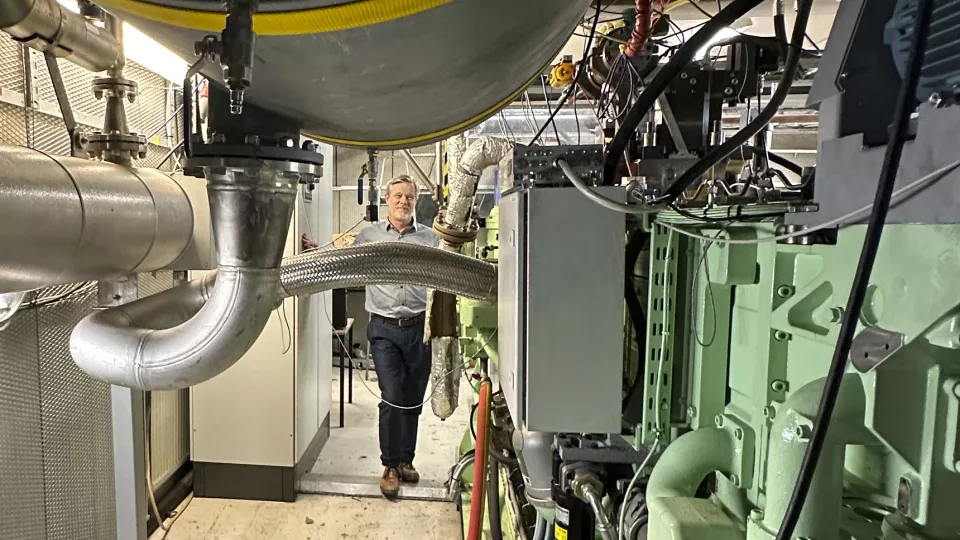 Photo of researcher Martin Tunér inside a engine research lab.
