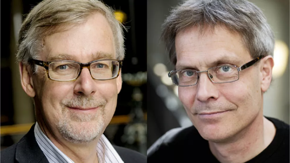 Two middleaged men with glasses