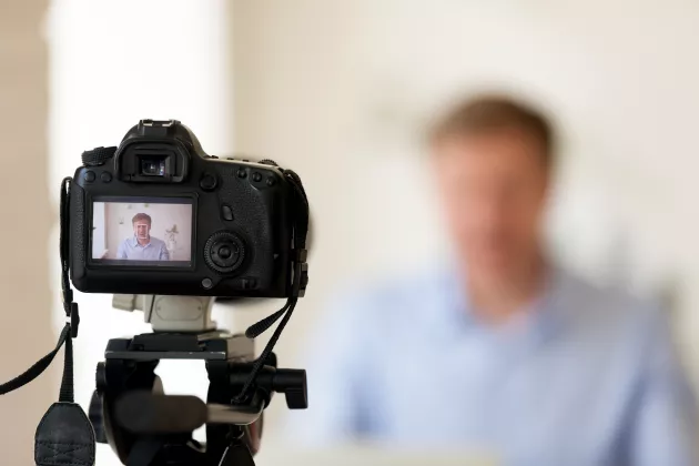 Illustrative image of a person being filmed.