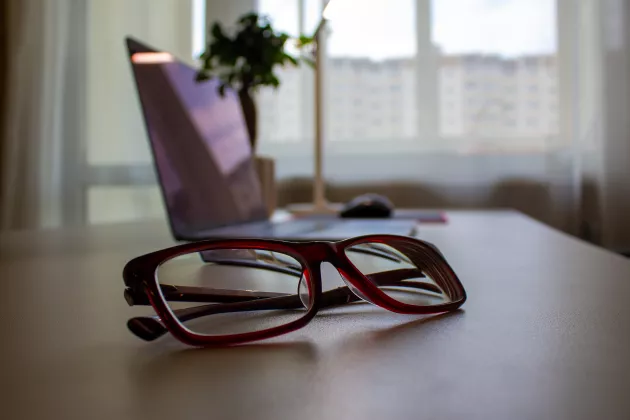 A pair of glasses on a table.