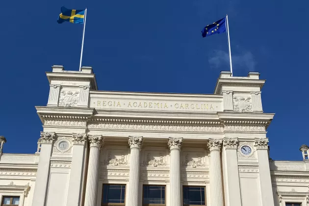 The university building with a swedish and EU flag.