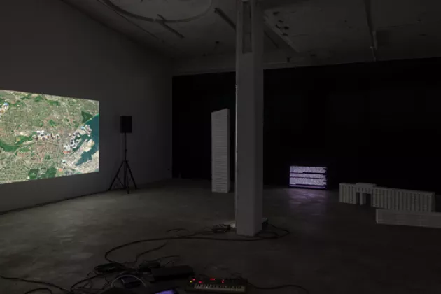 Exhibition view with video projection. Photo.