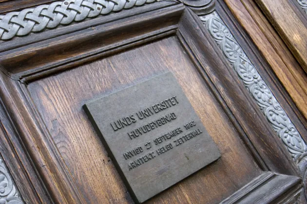 A photo of a door to the university main building.