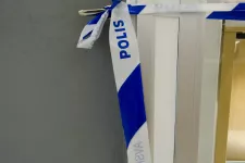 Police tape on a door.