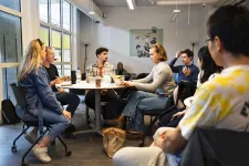 A group of people discuss in a group