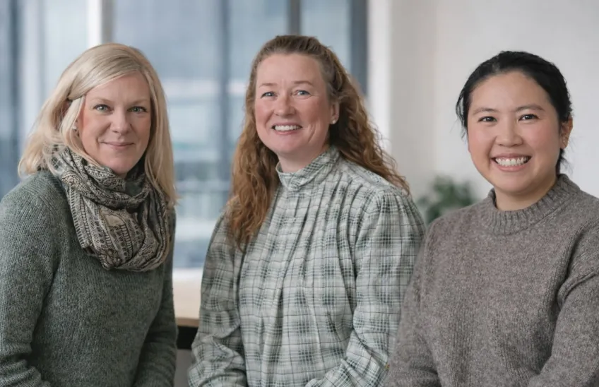 Three women looking in the camera.