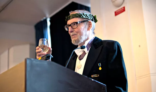 Elderly man holding a speech