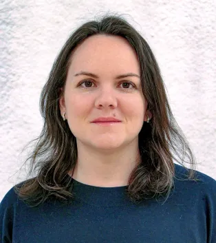 Portrait photo of woman looking in the camera and smiling.