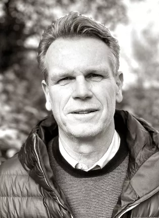A man in a jacket: Black and white photo. 